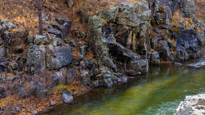 High canyon walls and a river in Pecos Canyon State Park, NM