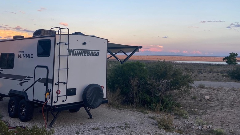 A Winnebago on the campground at Brantley Lake State Park in New Mexico at sunrise