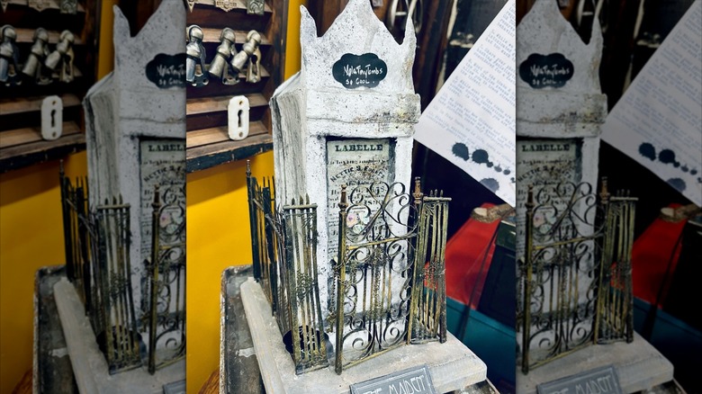 A miniature tomb sculpture with the name LaBelle