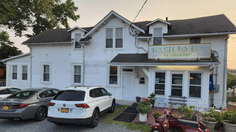 The exterior of Basilio Inn, featuring a faded sign