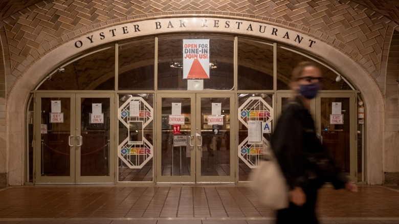 A pedestrian passing the Grand Central Oyster Bar