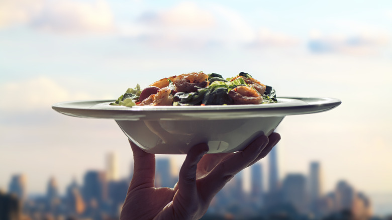 A plate of seafood against the NYC skyline