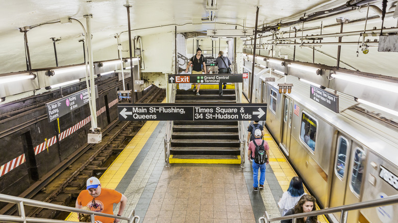 People riding the subway in New York City at Grand Central Station