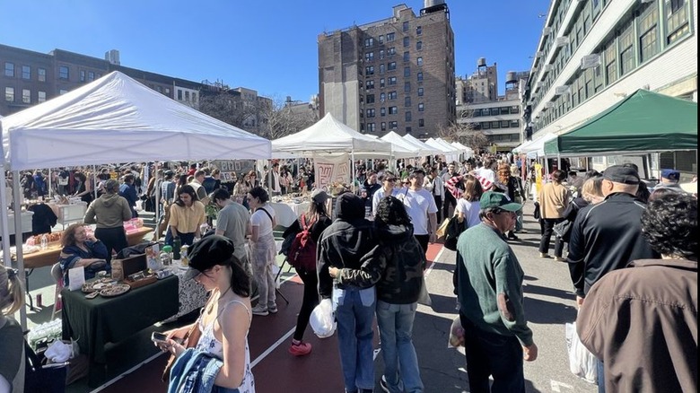 People browse vendor tents at the Grand Bazaar in NYC