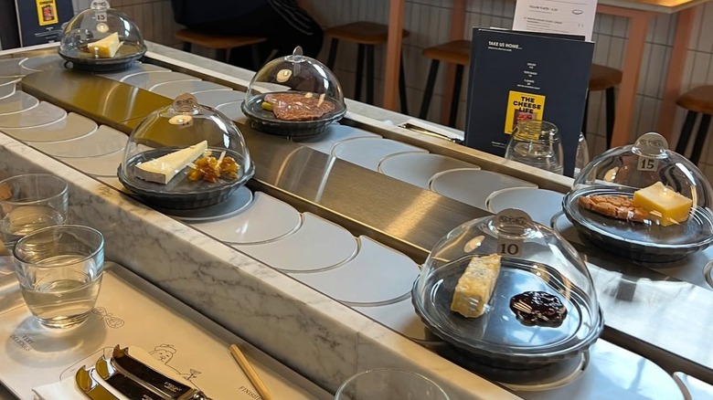 British artisan cheeses are served via conveyor belt at Pick & Cheese in London.