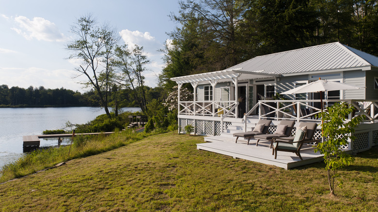 View of a Catskills lake house on a sunny day