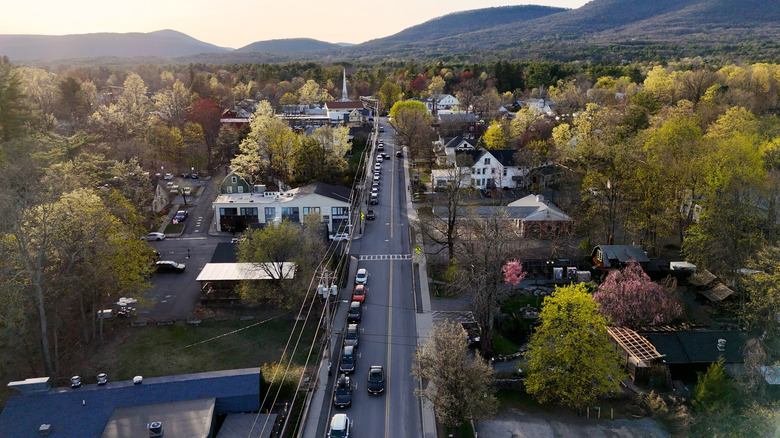 Aerial view of a street in Woodstock, New York with mountains in background