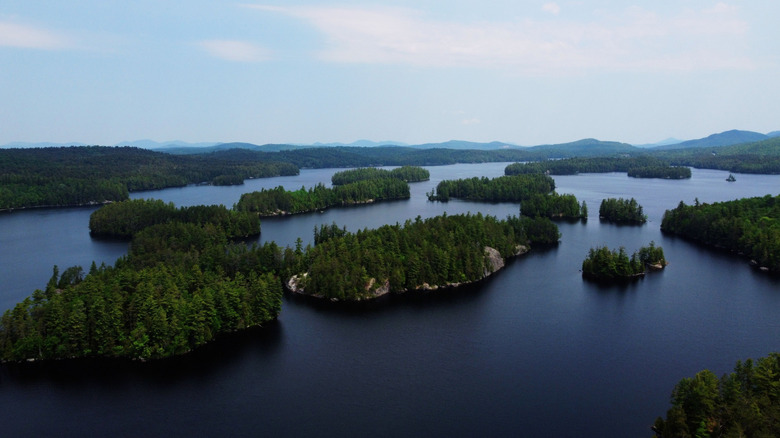 Aerial view of Lower Saranac Lake on a cloudy summer day.