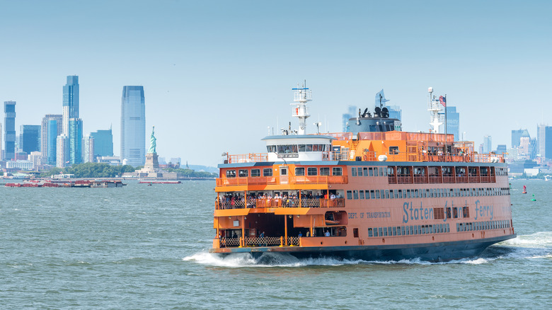staten island ferry passing the statue of liberty