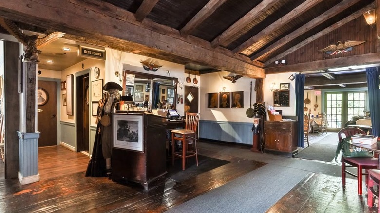 The wooden interior of the '76 House with artifacts adorning its walls