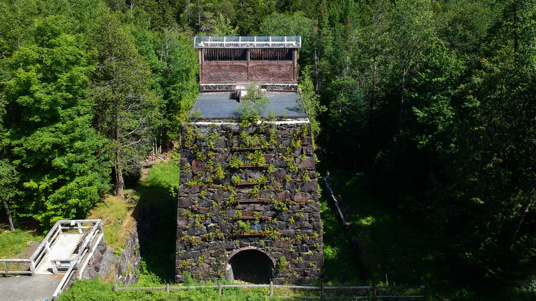 an abandoned iron smelter, now overgrown with plants, in Tahawus in the Adirondacks of New York
