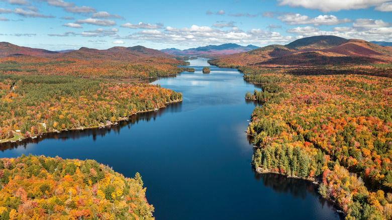 Long lake in the Adirondacks during autumn from above