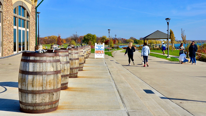 A row of wine barrels on display in front of the Finger Lakes Welcome Center on the northern shore of Seneca Lake