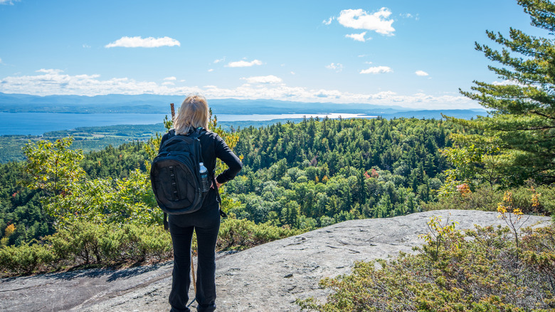 Hiker looking at the view from Rattlesnake mountain in Willsboro NY