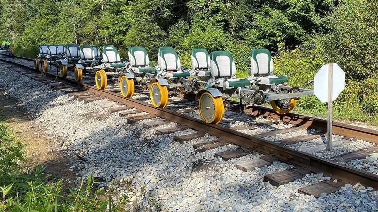 An empty rail bike parked on a train track