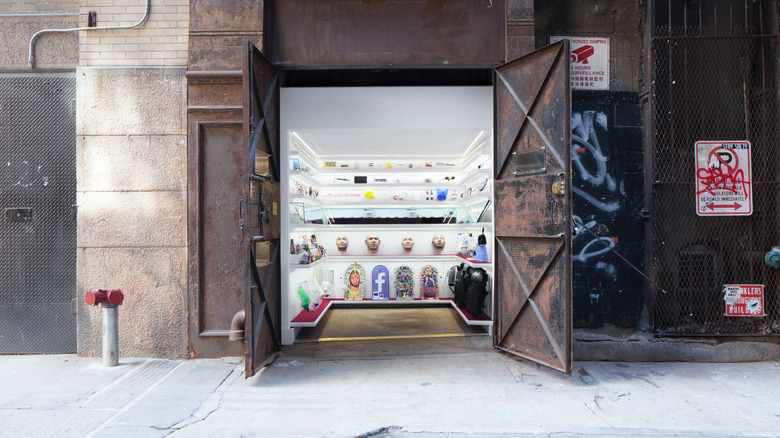 Tiny museum inside elevator shaft by sidewalk