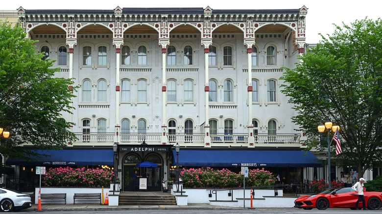 a hotel on a tree lined sttreet