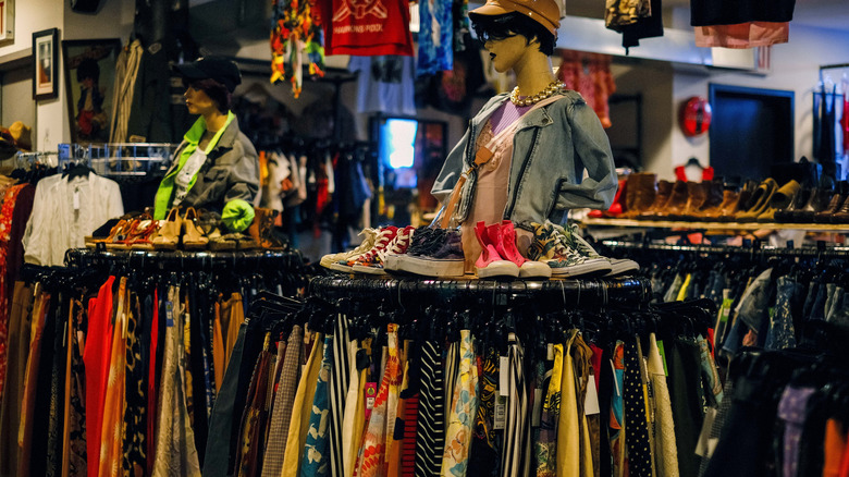 Clothing racks with mannequin heads in a secondhand shop in Williamsburg, Brooklyn