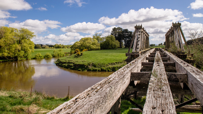 Old wooden rail bridge crossing the Pomahaka River near Tapanui