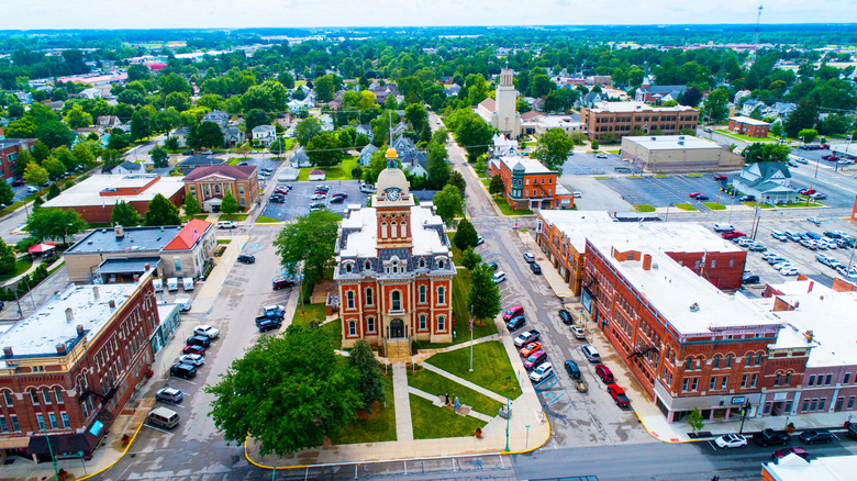 Aerial view of downtown Decatur with cars and redbrick buildings around the Adams County Circuit Court building