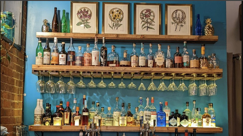 Colorful bar lined with glasses and spirits at 9th Street Bistro in Noblesville, Indiana