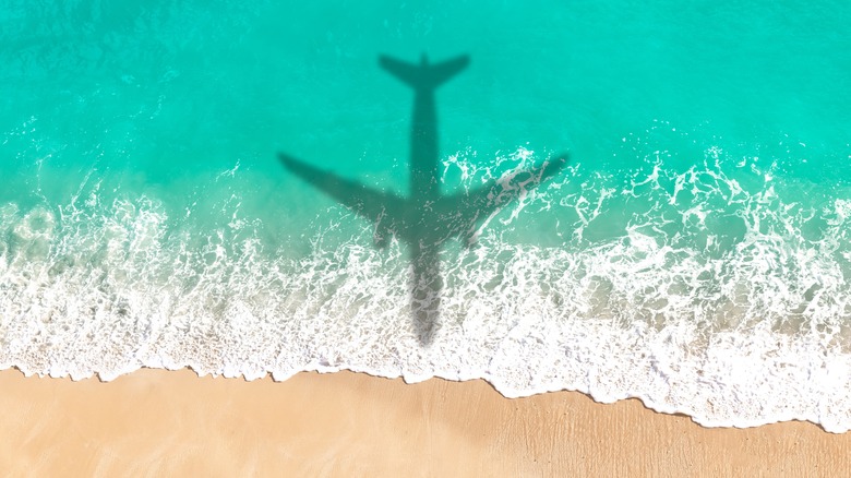 Flight hovering over sand