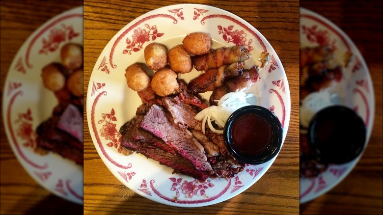 A plate of brisket and hushpuppies from Midwood Smokehouse in Charlotte, North Carolina