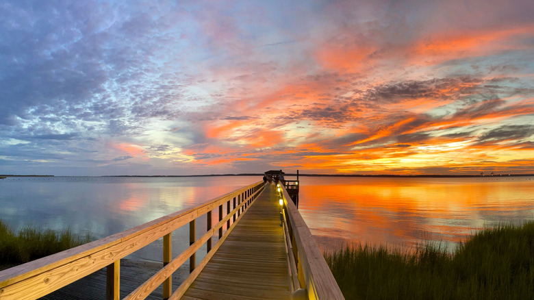 Kure Beach Pier at sunset, overlooking the ocean.