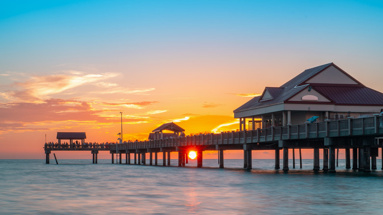 Shot of a fishing pier at sunset