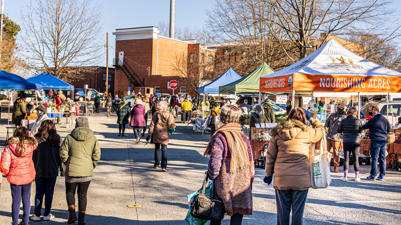 People shop at the Carrboro Farmers Market in the winter