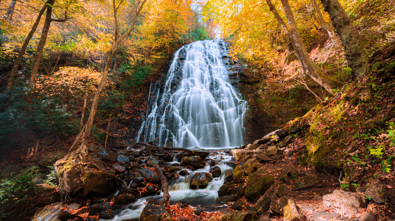 Crabtree Falls flowing over rocks amid fall foliage