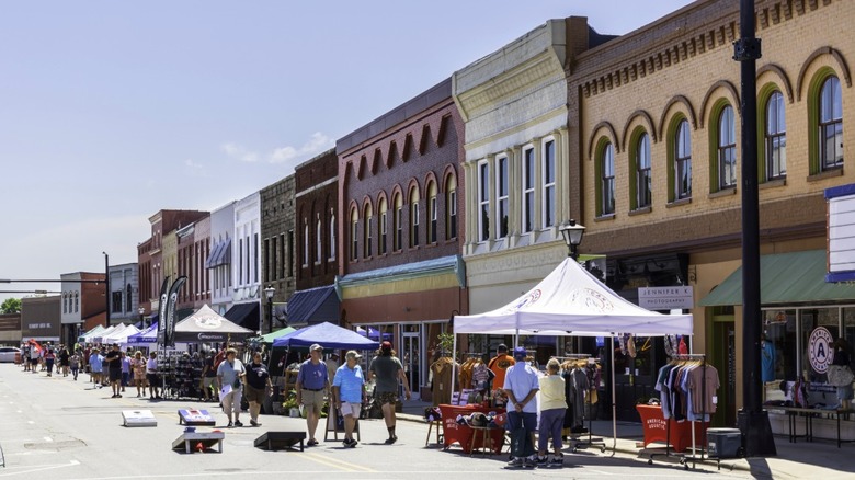 An outdoor festival with tents lining the main street in Elkin, NC