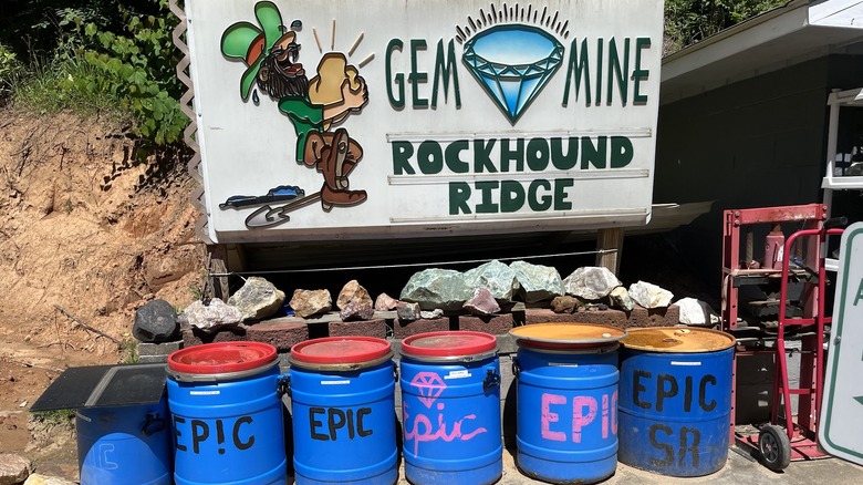 Rockhound Ridge Gem Mine signage juxtaposed with large gems and rocks