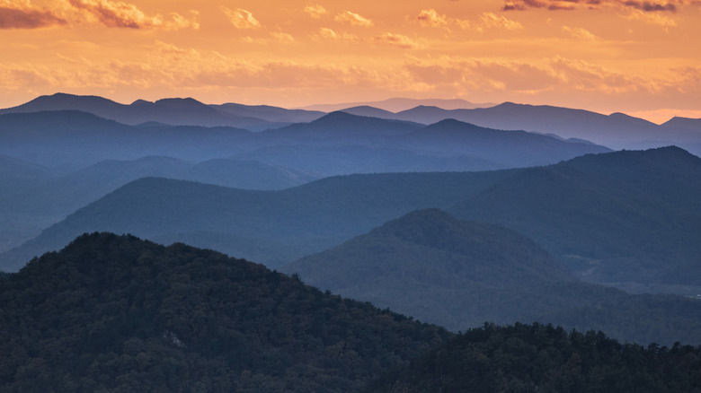 sunset over blue ridge mountain shadows with trees in North Carolina