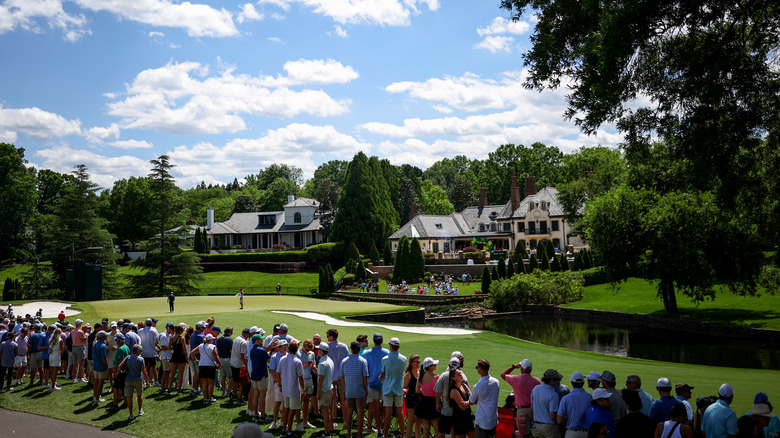 Quail Hollow hole 7 with mansions in background