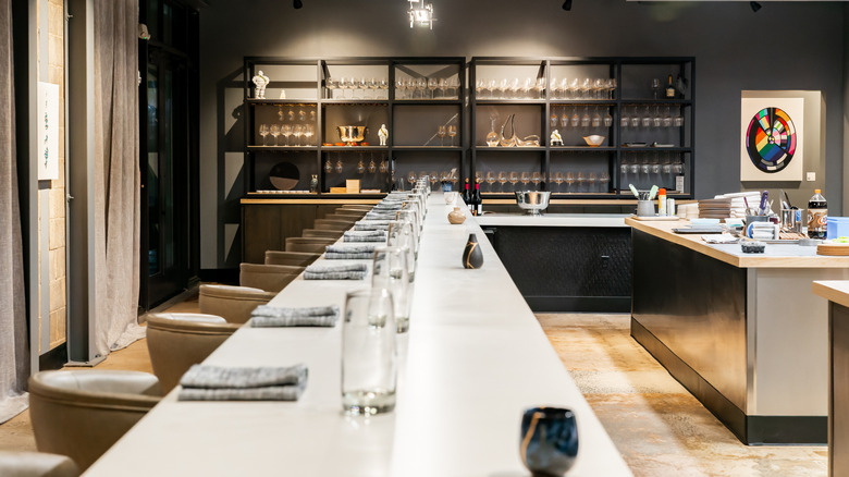 View of the open concept kitchen and dining counter ready for service at Counter-