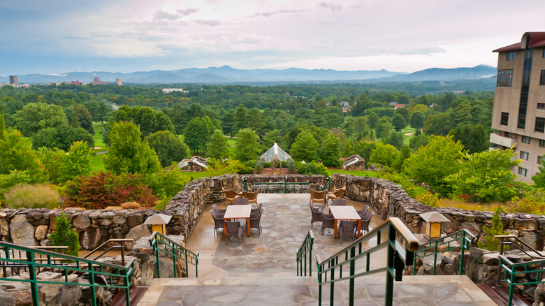 Flagstone steps and terrace overlooking green trees and Blue Ridge Mountains Sunset Terrace restaurant