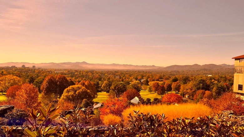 View from Sunset Terrace with orange dusk light over fall foliage