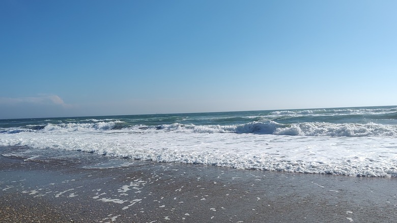 frothy waves come onto the beach at Fort Macon State Park