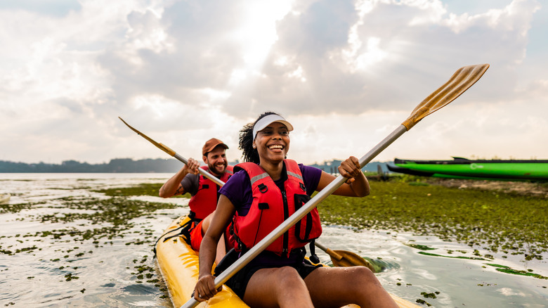 Couple kayaking in lake