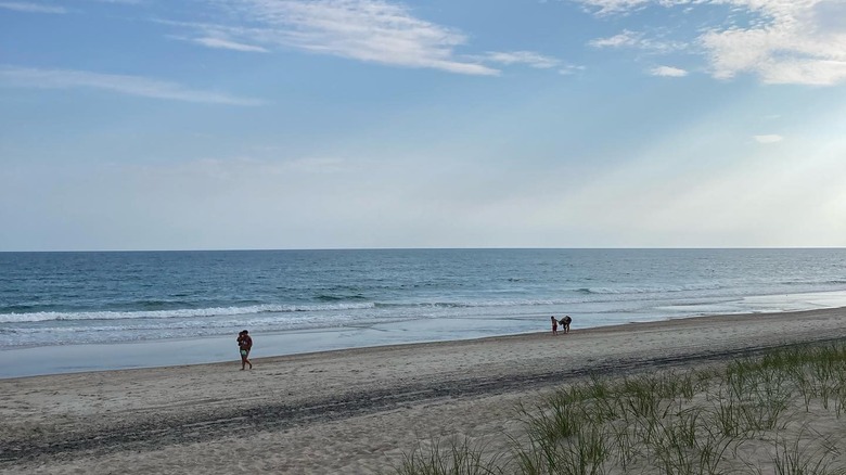 People walking on the beach in Salter Path, NC