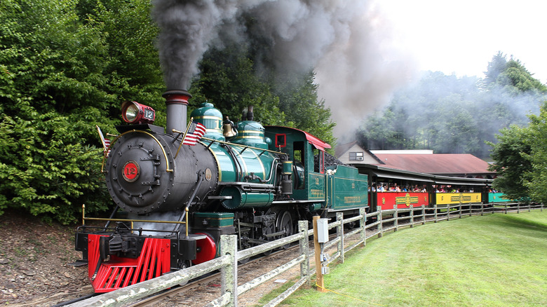 The train at Tweetsie Railroad with black smoke and passengers on board