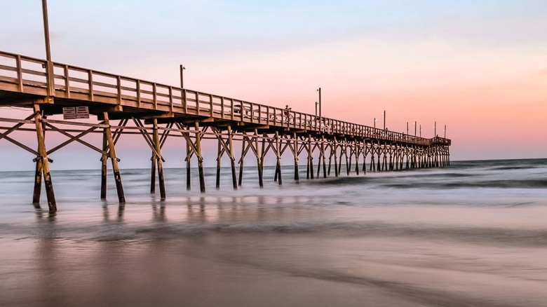Sunset Beach Pier in Brunswick County, North Carolina, at dusk
