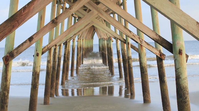 A view from underneath Sunset Beach Pier in Brunswick County, North Carolina