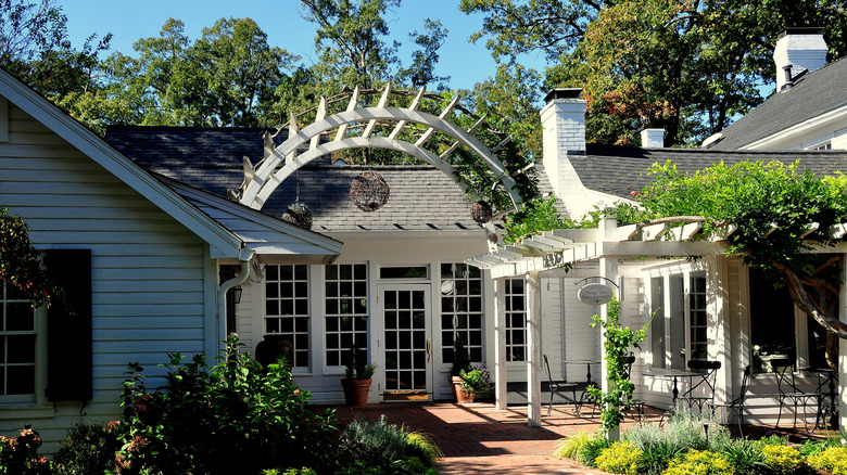 Exterior of Fearrington House with verdant greenery