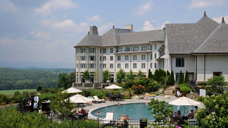Guests lounging in the swimming pool at The Inn on Biltmore Estate