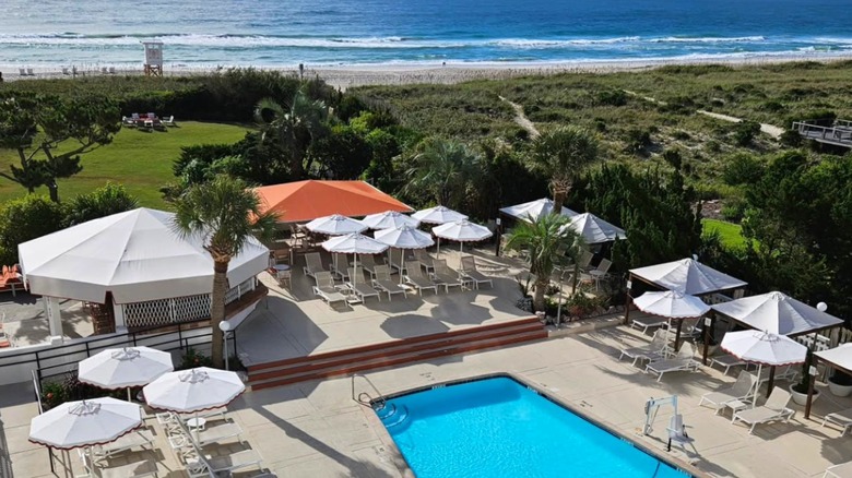 View of pool and beach at Trailborn Surf & Sound