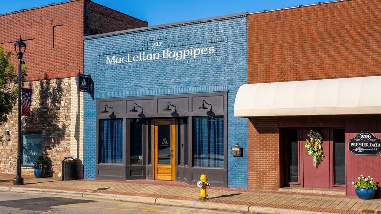 The unassuming blue shopfront for MacLellan Bagpipes in Zebulon.