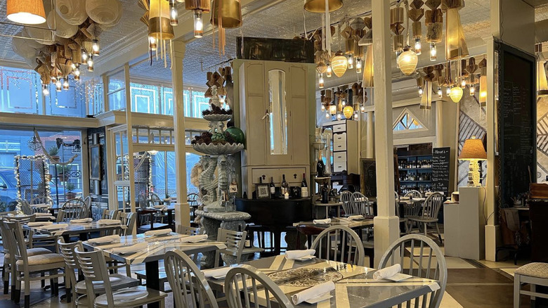 Eclectic chandeliers and decor in the dining room of Spoon River Artworks and Market