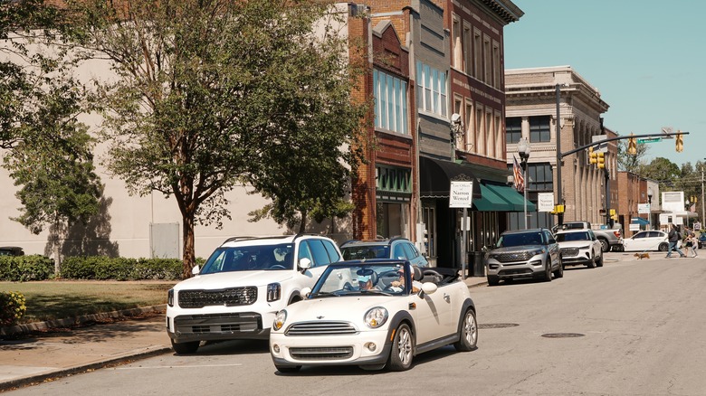 Convertible Mini Cooper driving through Downtown Smithfield, North Carolina